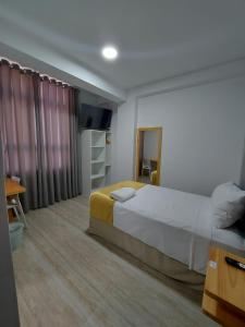 Postel nebo postele na pokoji v ubytování Bendezu Hotel