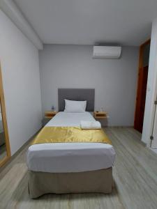 Postel nebo postele na pokoji v ubytování Bendezu Hotel