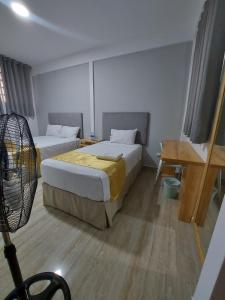 Postel nebo postele na pokoji v ubytování Bendezu Hotel