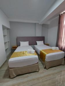 Postel nebo postele na pokoji v ubytování Bendezu Hotel