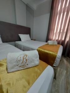 Postel nebo postele na pokoji v ubytování Bendezu Hotel