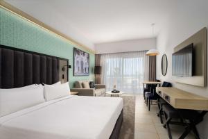 Katil atau katil-katil dalam bilik di Radisson Blu Resort Saidia Beach