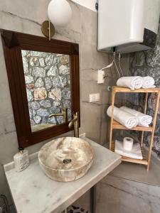 a bathroom with a large stone sink and towels at Amos Sea View in Marmaris +73 photos
