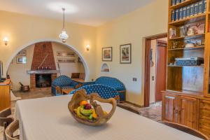 a living room with a table with a bowl on it at Ambelos Country House in Keri