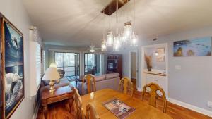 a kitchen and dining room with a table and chairs at Golf Lover's Haven Modern One-Bedroom Suites in Pawleys Island