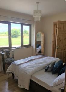Postel nebo postele na pokoji v ubytování Beachmount House
