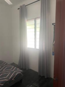 Postel nebo postele na pokoji v ubytování Homestay Abor