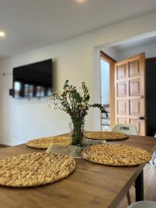 a table with three pizzas on top of it at Apartamento Marquesa in Villa de Leyva +4 photos