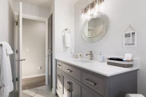 a bathroom with a sink and a mirror at Perch - Sierra Retreat 34 in Coupeville +60 photos
