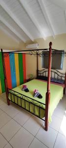 Letto o letti in una camera di CAS IGUANA - Curacao - Villapark Fontein - Ferienhaus mit Pool