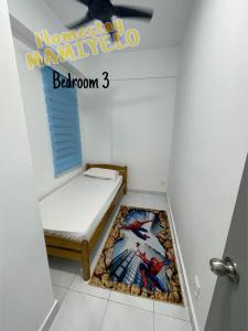 a small room with a bed and a window at Homestay MAMIYELO at Apartment Trifolia 1, Klang - Islamic compliance homestay in Klang +5 photos