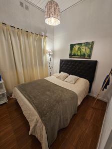 Postel nebo postele na pokoji v ubytování Grace’s House, Ezeiza Airport + 10 fotografií