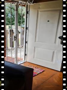 an open door in a living room with a door at Cabaña en las Sierras, Sierras Rio Sol!!! Espectacular Cabaña Frente al Rio y las Sierras in Santa María +26 photos
