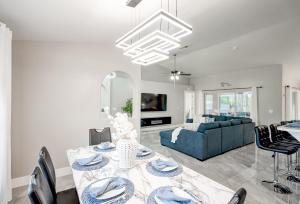 A television and/or entertainment centre at Four Bedrooms Oasis with Heated Pool Private Jacuzzi and Billiards