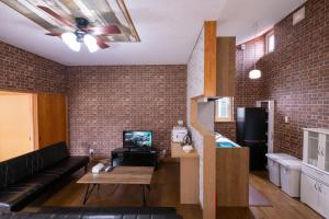 Μια τηλεόραση ή/και κέντρο ψυχαγωγίας στο 巴ドットcom Premium Stay