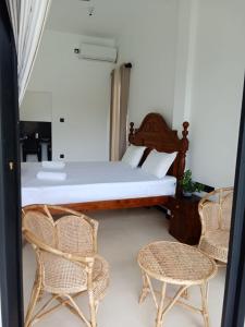 Postel nebo postele na pokoji v ubytování Madushan Garden & Villa