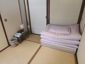 Postel nebo postele na pokoji v ubytování Hotel Lantern Gion