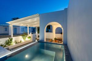 a swimming pool in the middle of a house at Villa Kocis in Monolithos