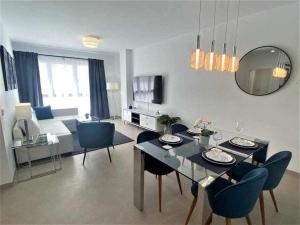TV a/nebo společenská místnost v ubytování XIV Apartamentos Morales y Arnal