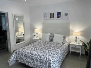 En eller flere senge i et værelse på XIX C Apartamentos Morales & Arnal