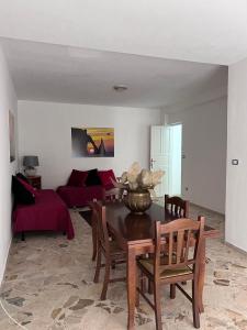 a living room with a table and a couch at Casa di Pippo in Trappeto +7 photos