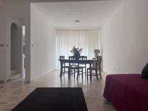 a dining room with a table and some chairs at Casa di Pippo in Trappeto