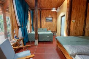 Ένα ή περισσότερα κρεβάτια σε δωμάτιο στο Cinnamon Eco Lodge