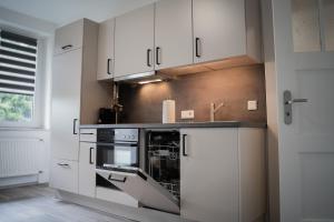 Kuchyň nebo kuchyňský kout v ubytování JUNIK Apartments Oberhausen
