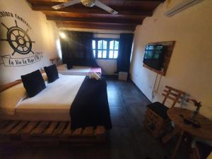 Postel nebo postele na pokoji v ubytování Casa Hostal La Vie en Rose