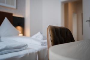 Postel nebo postele na pokoji v ubytování JUNIK Apartments Oberhausen