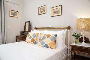Postel nebo postele na pokoji v ubytování Venti Di Paxos