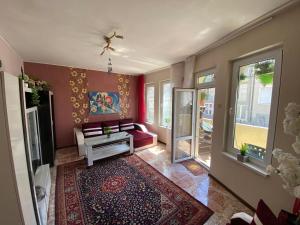 a living room with a couch and a table at Centrum in Burgas City