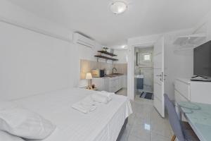 Postel nebo postele na pokoji v ubytování Apartments Petrina