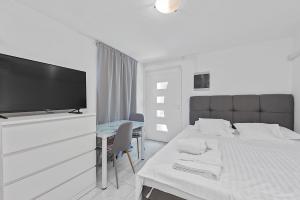 Postel nebo postele na pokoji v ubytování Apartments Petrina