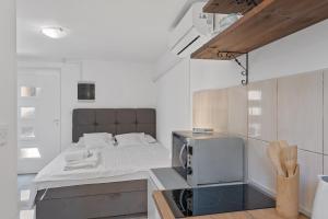 Postel nebo postele na pokoji v ubytování Apartments Petrina