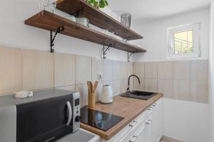 Kuchyň nebo kuchyňský kout v ubytování Apartments Petrina