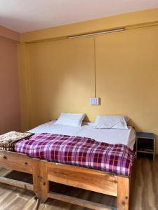 Postel nebo postele na pokoji v ubytování Parvati Central