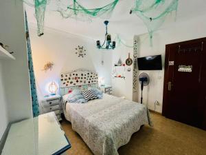 Postel nebo postele na pokoji v ubytování La Casa de La Abuela Rosy