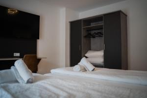 Postel nebo postele na pokoji v ubytování JUNIK Apartments Oberhausen