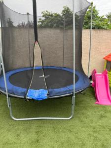 a trampoline in a tent in a yard at La perle rare in Le Grau-dʼAgde