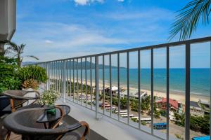a balcony with a view of the beach and ocean at BlueSun Danang Beach Hotel in Danang