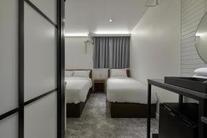 Postel nebo postele na pokoji v ubytování Eight Rest Hostel Myeongdong