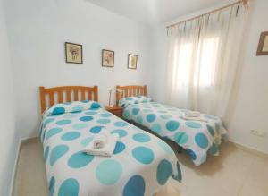 Posteľ alebo postele v izbe v ubytovaní Apartment Cala de Nerja SpainSunRentals 1083