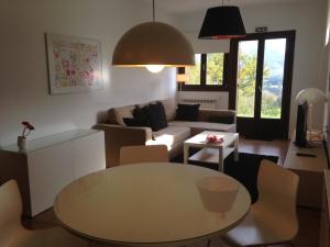 a living room with a table and a couch at Casa Rural Balerdi in Azcárate