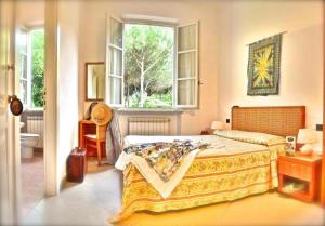 Postel nebo postele na pokoji v ubytování Hotel Villa Fiorisella