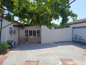a garage with a bike parked outside of a house at Cozy room in Pula +11 photos