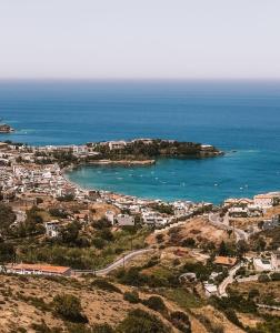 an aerial view of a city and the ocean at Miros apts in Agia Pelagia 50m from the beach in Agia Pelagia