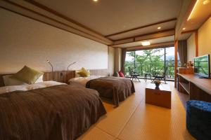 Voodi või voodid majutusasutuse Kintarou Onsen Hotel toas