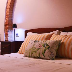 En eller flere senge i et værelse på Agriturismo Cascina Cipressa