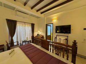 TV a/nebo společenská místnost v ubytování La Plage Seaview Suites
